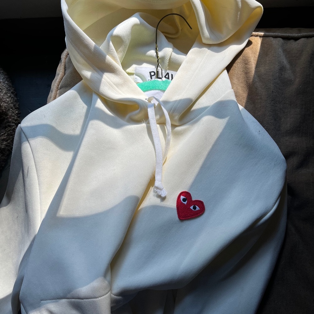 Never warn pale yellow comme de garçon play pullover hoodie
